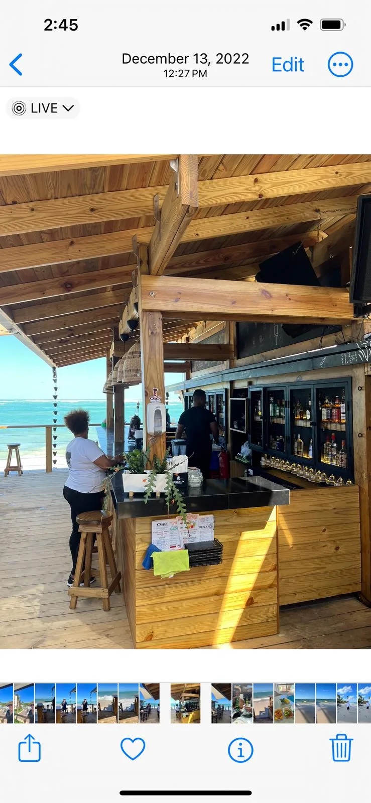 Beachfront bar over the turquoise ocean